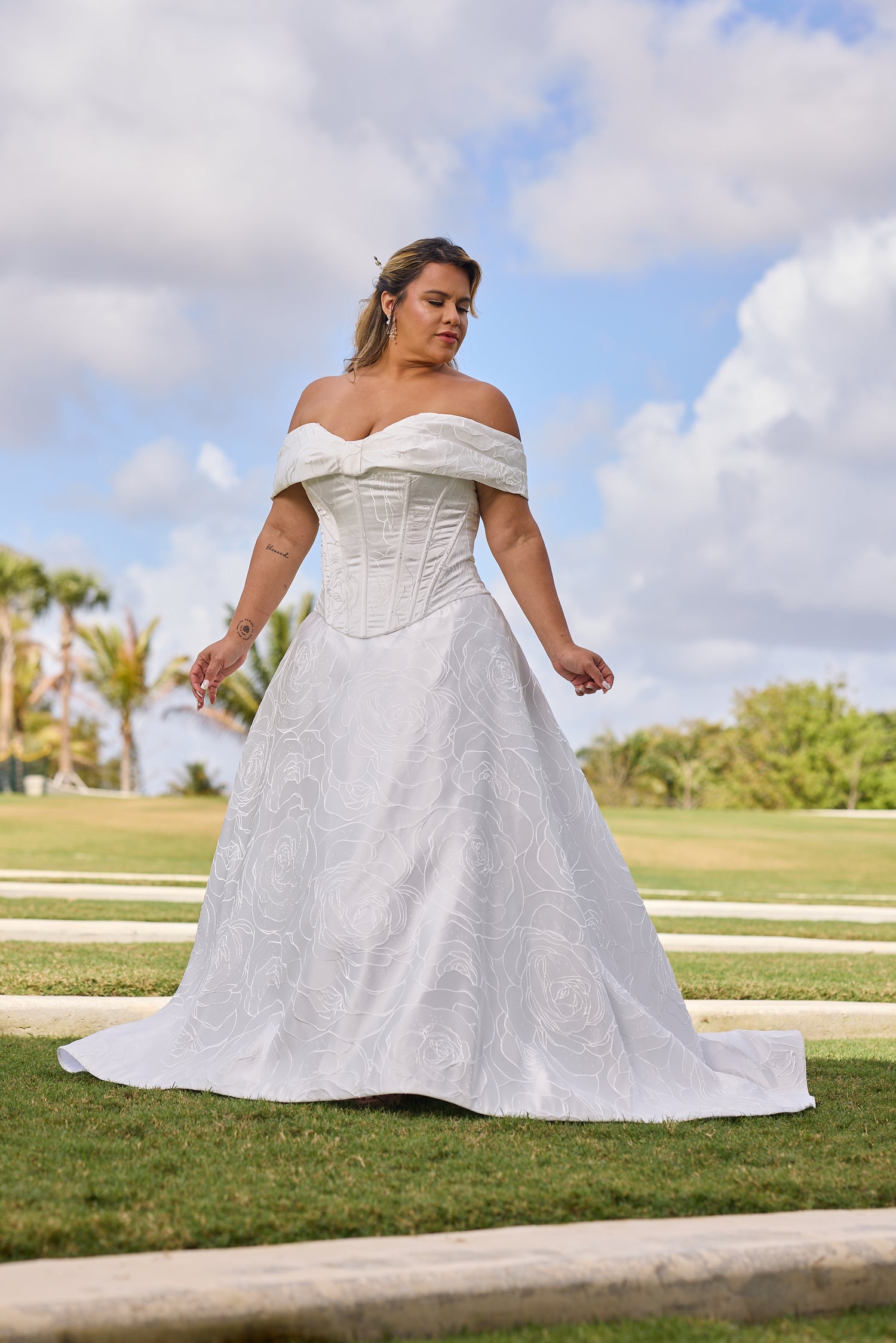 Woman in a white wedding dress, design by Alexas
