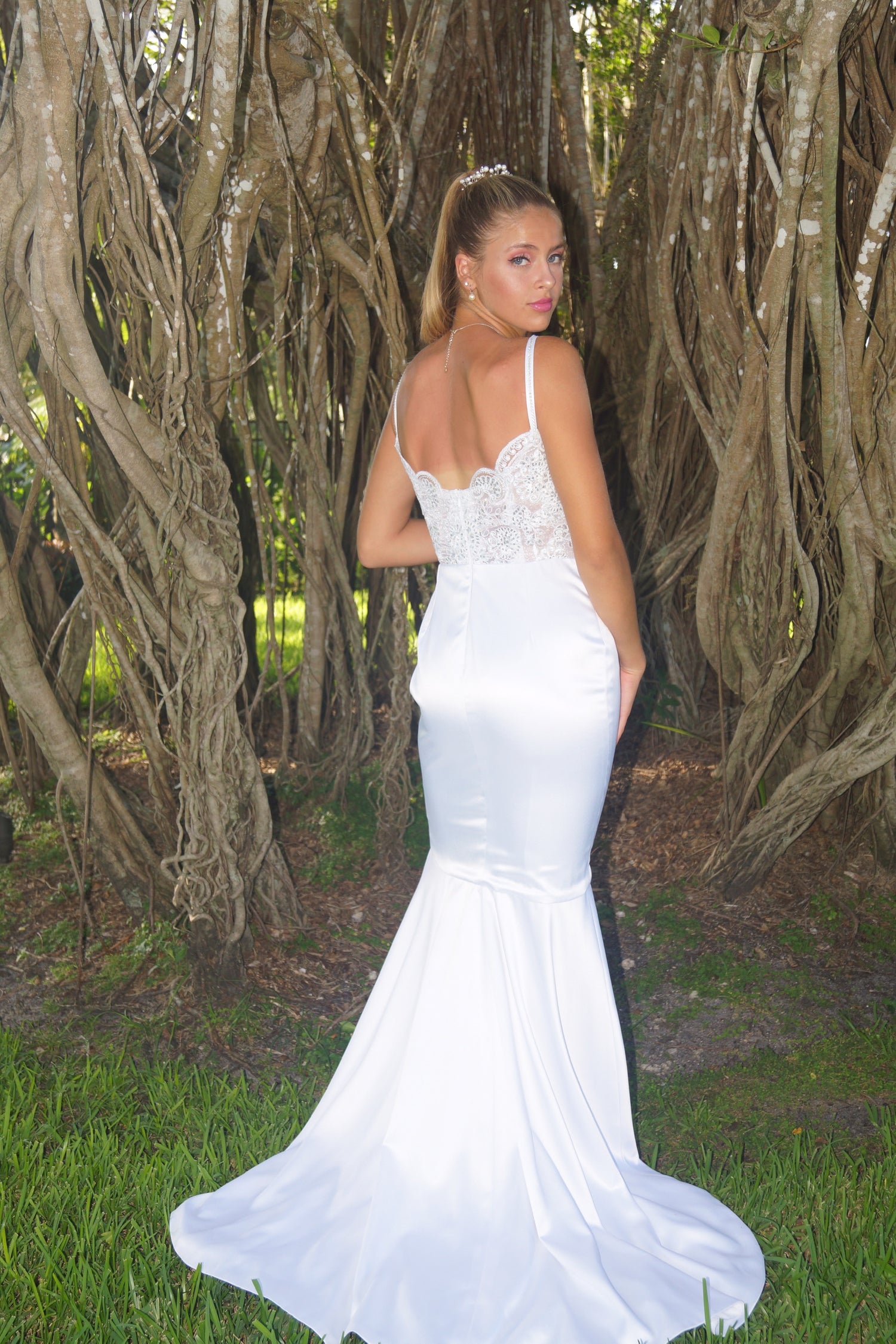 Woman in a white wedding dress, design by Alexas
