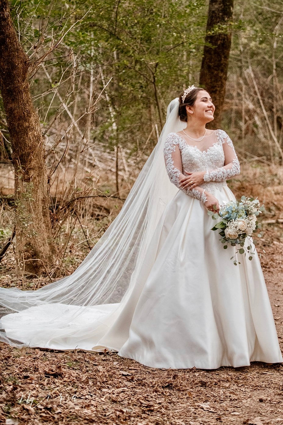 Woman in a white wedding dress, design by Alexas