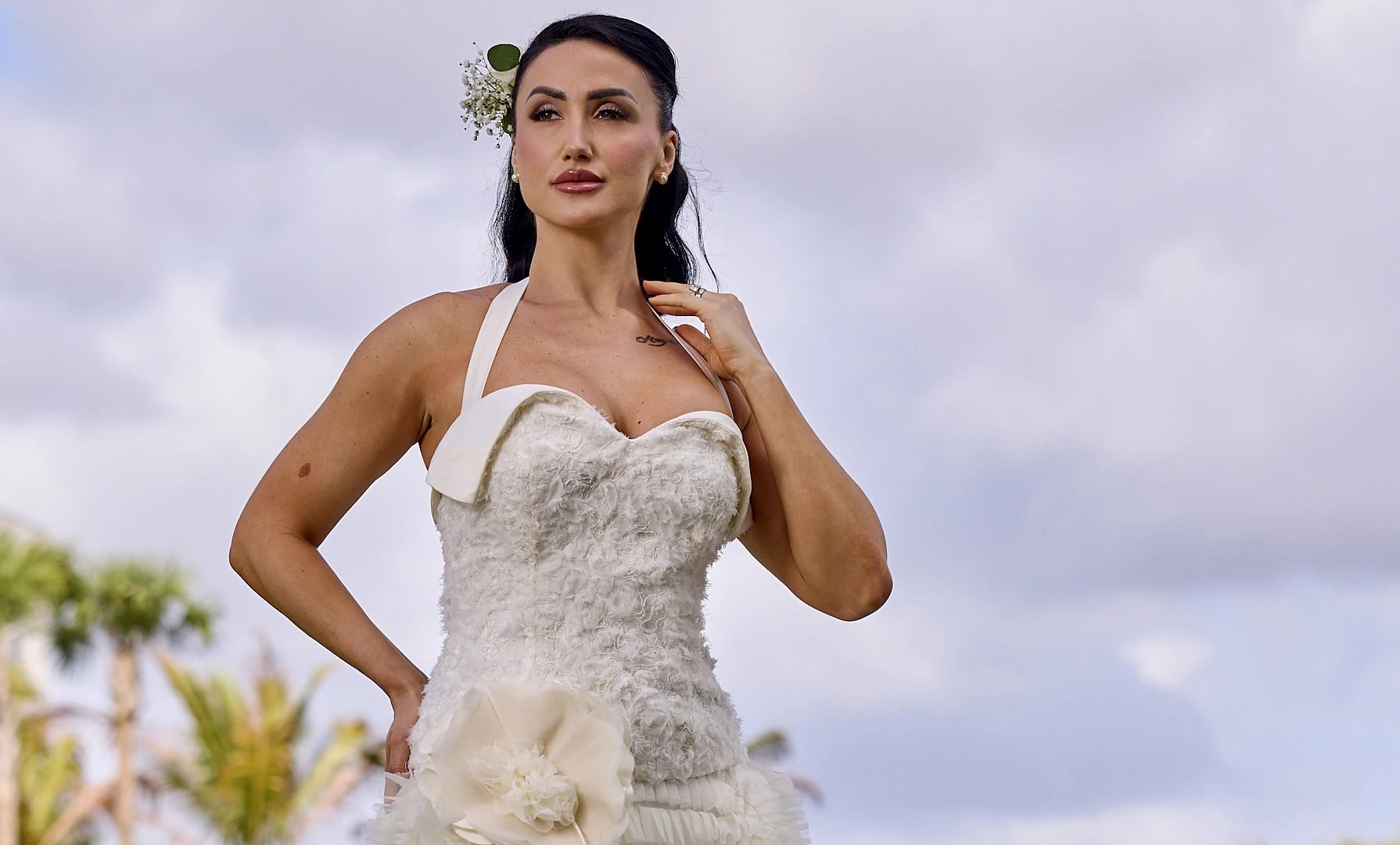 Woman in a white wedding dress designed by Alexas