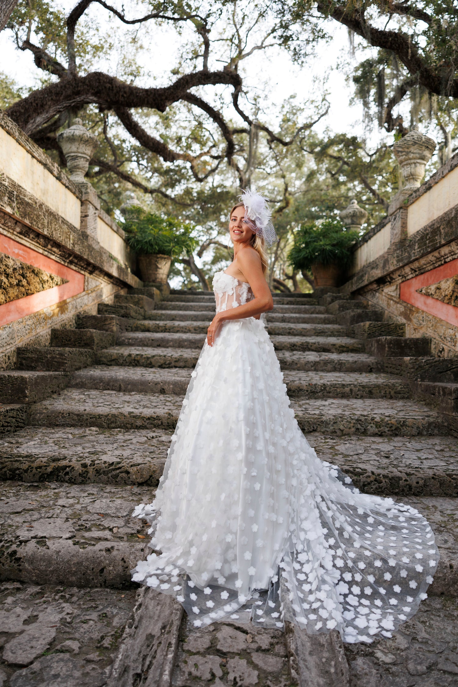 Bride in a white wedding dress, design by Alexas