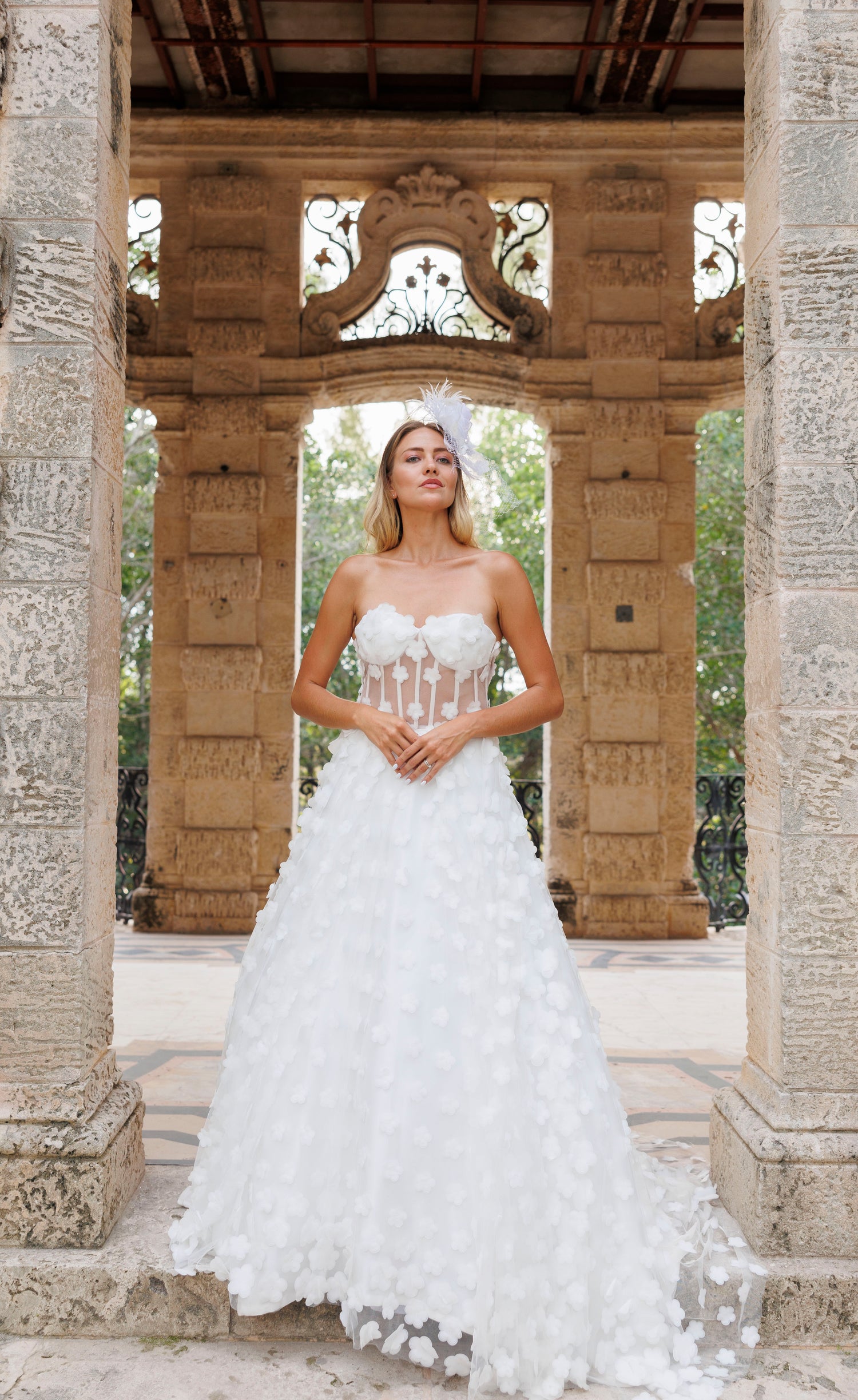 Woman in a white wedding dress, design by Alexas