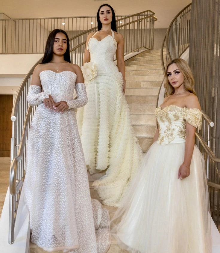 Three women in elegant evening gowns, design by Alexas
