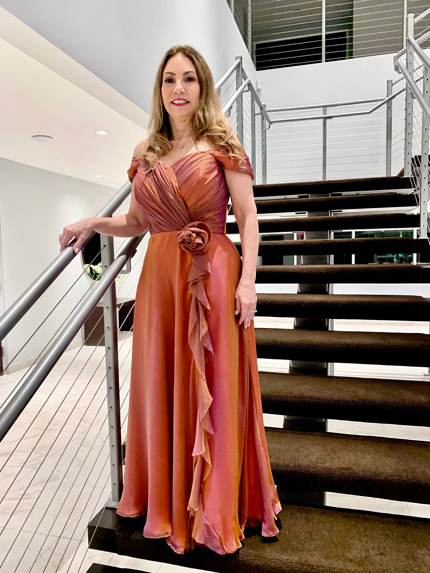 Woman in a pink evening gown, design by Alexas